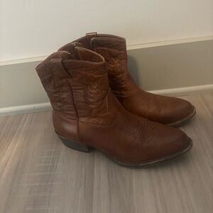 Brown ankle cowboy boots with a small heel